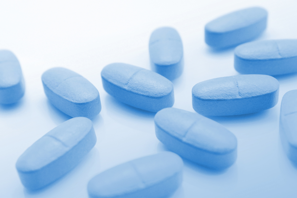Medical blue background with pills