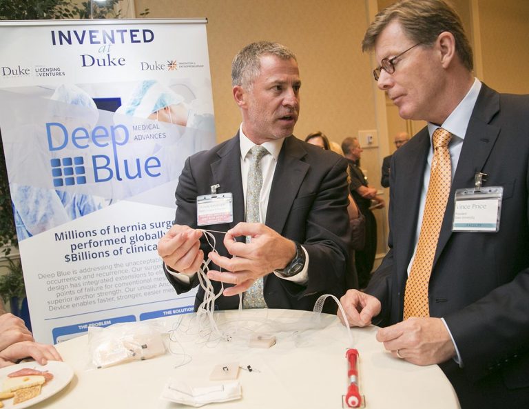 Dr. Howie Levinson shows off his hernia mesh design to President Price. Deep Blue is addressing the unacceptably high rate of hernia occurrence and recurrence. Photo by Jared Lazarus/Duke Photography